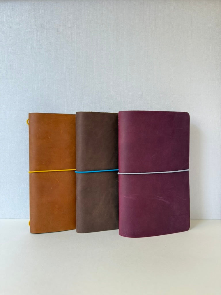 journals tamaño classic, colores camel, cafe y burdeo